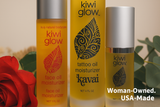 Kiwi Glow organic skincare line featuring sesame oil-based moisturizers for face, body, and tattoo care, photographed with a red rose and eucalyptus leaves.