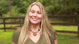 Kiwi Glow founder Ana Robinson smiling outdoors in Asheville, North Carolina
